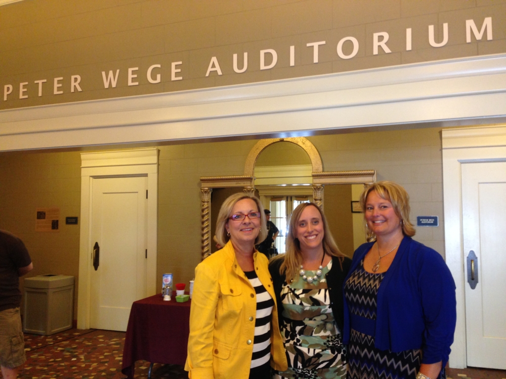 Ellen Satterlee, CEO of The Wege Foundation, Katy Furtado, Administrative Assistant, and CFO Jody Price honoring the name above them and celebrating The Foundation’s gift of LED lighting to Wealthy Theatre.