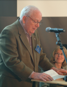 Peter M. Wege welcoming over 70 environmental scientists from around the country to a conference at Steelcase on saving the Great Lakes in May of 2004.